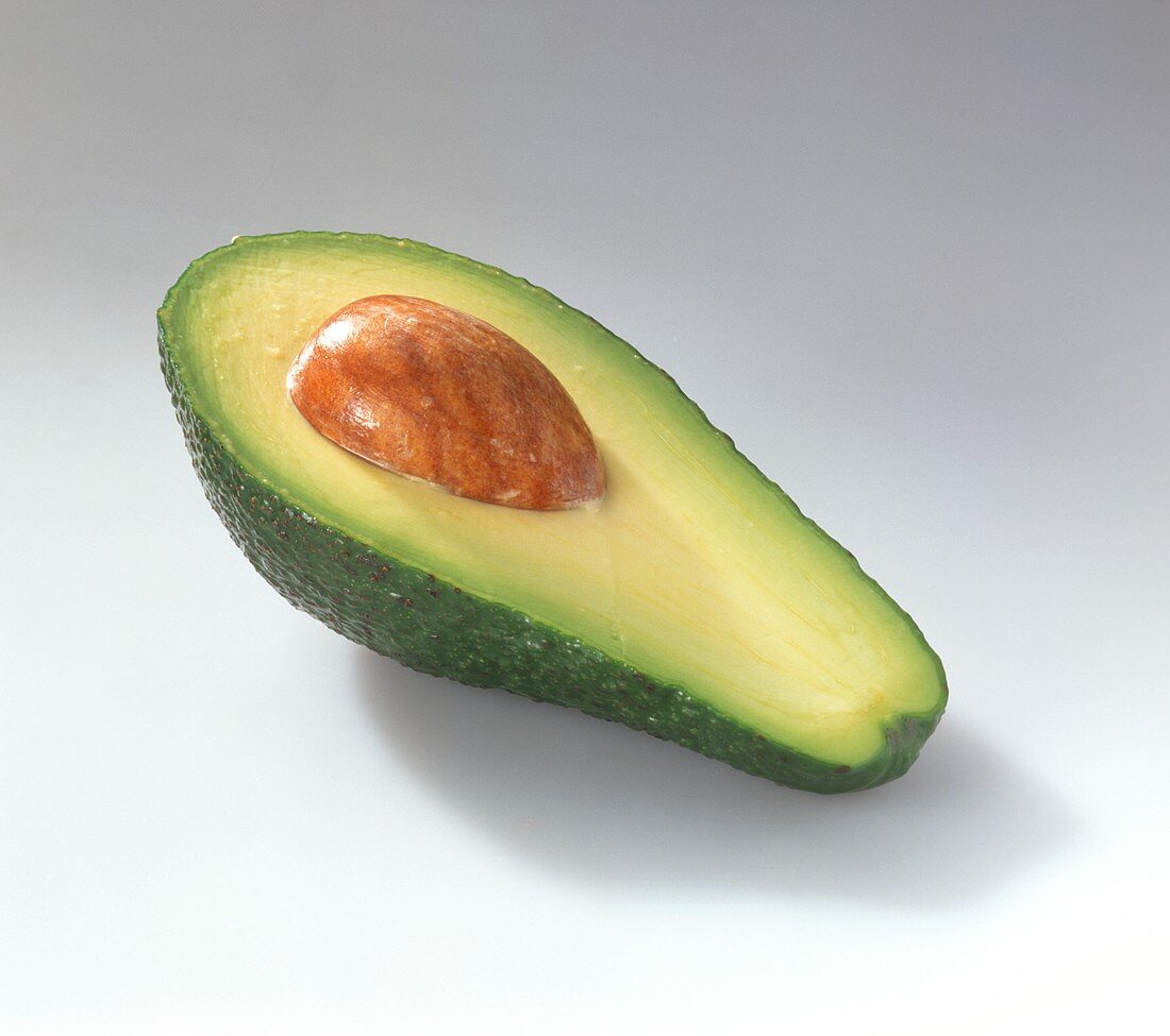 Half an avocado with stone