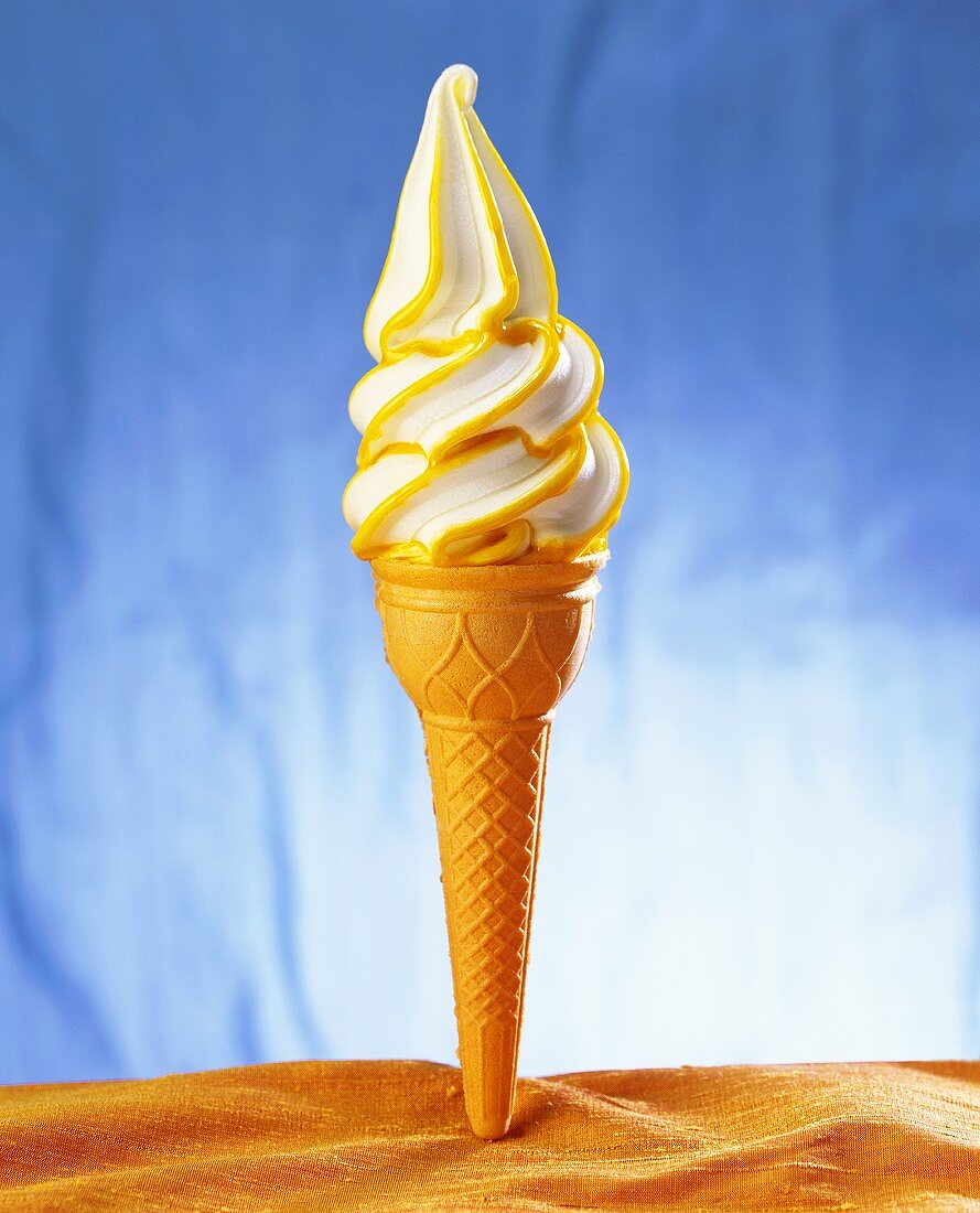 Ice cream cornet with soft ice cream (vanilla and orange)
