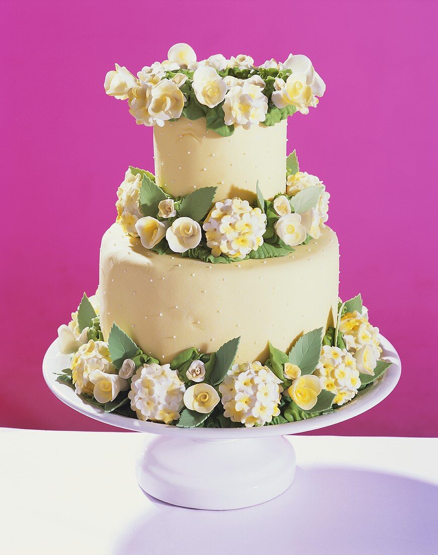 Two-tiered wedding cake with flowers