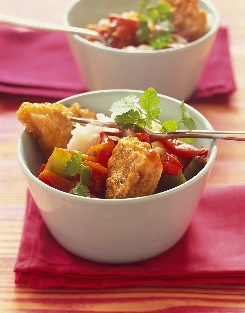 Deep-fried fish with a pepper medley and rice