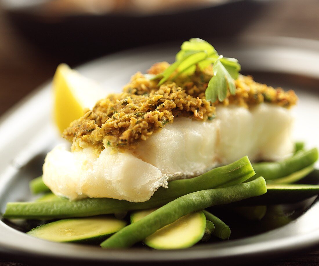 Fish with herb crust on green beans
