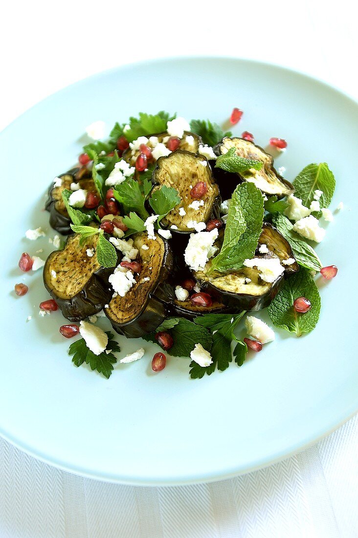 Aubergine salad with pomegranate seeds, herbs & feta