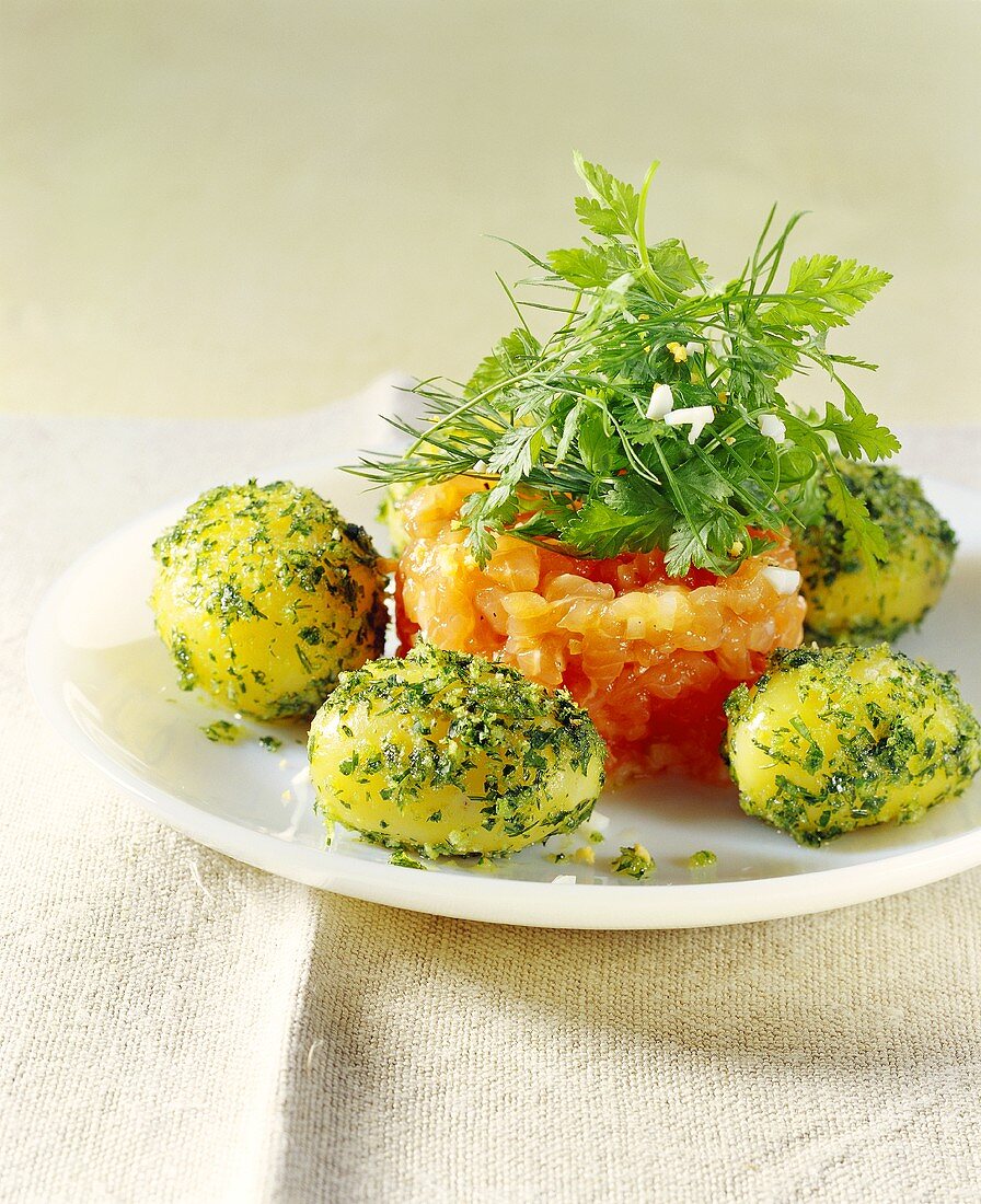 Salmon trout tartare with herbs and potatoes
