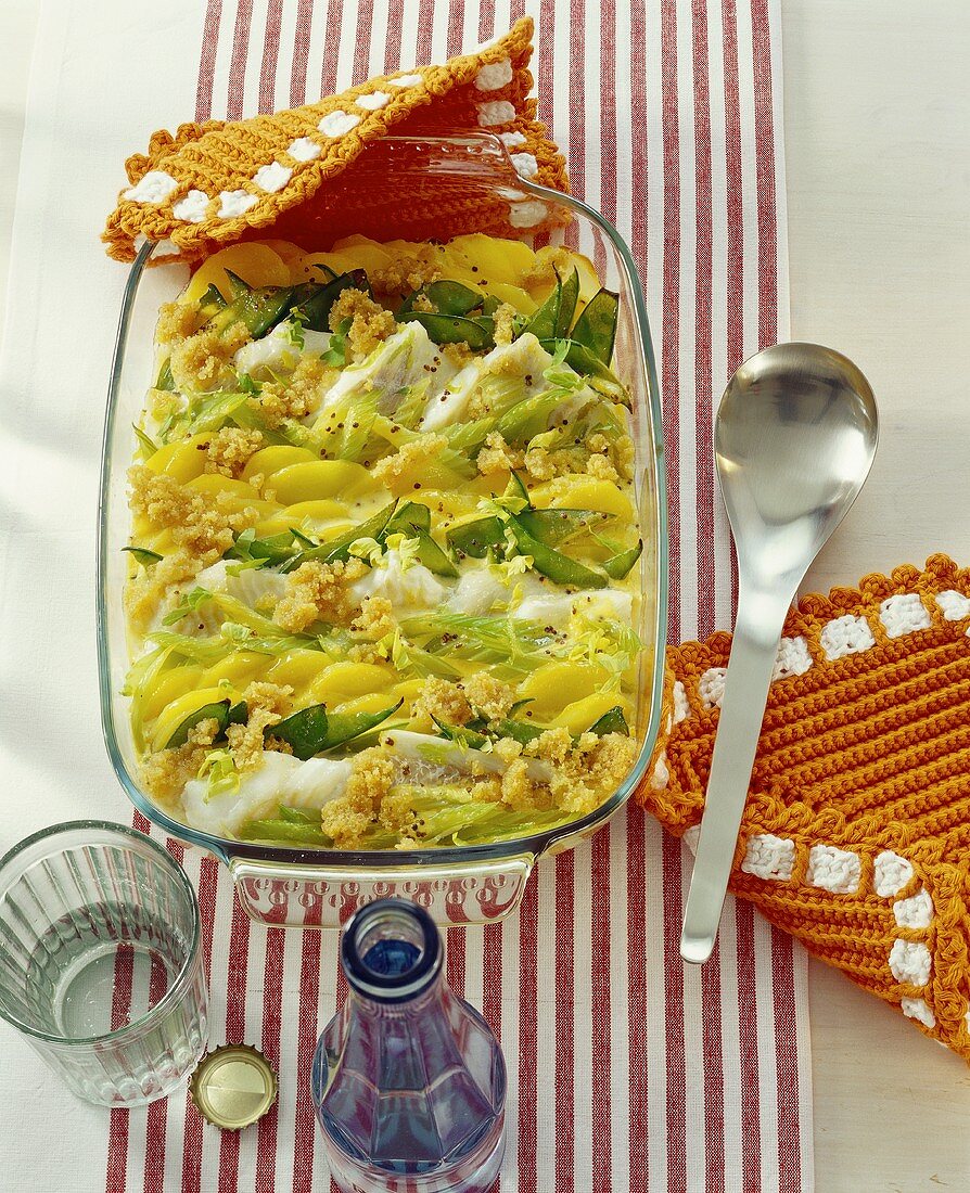 Fish and potato gratin in the baking dish