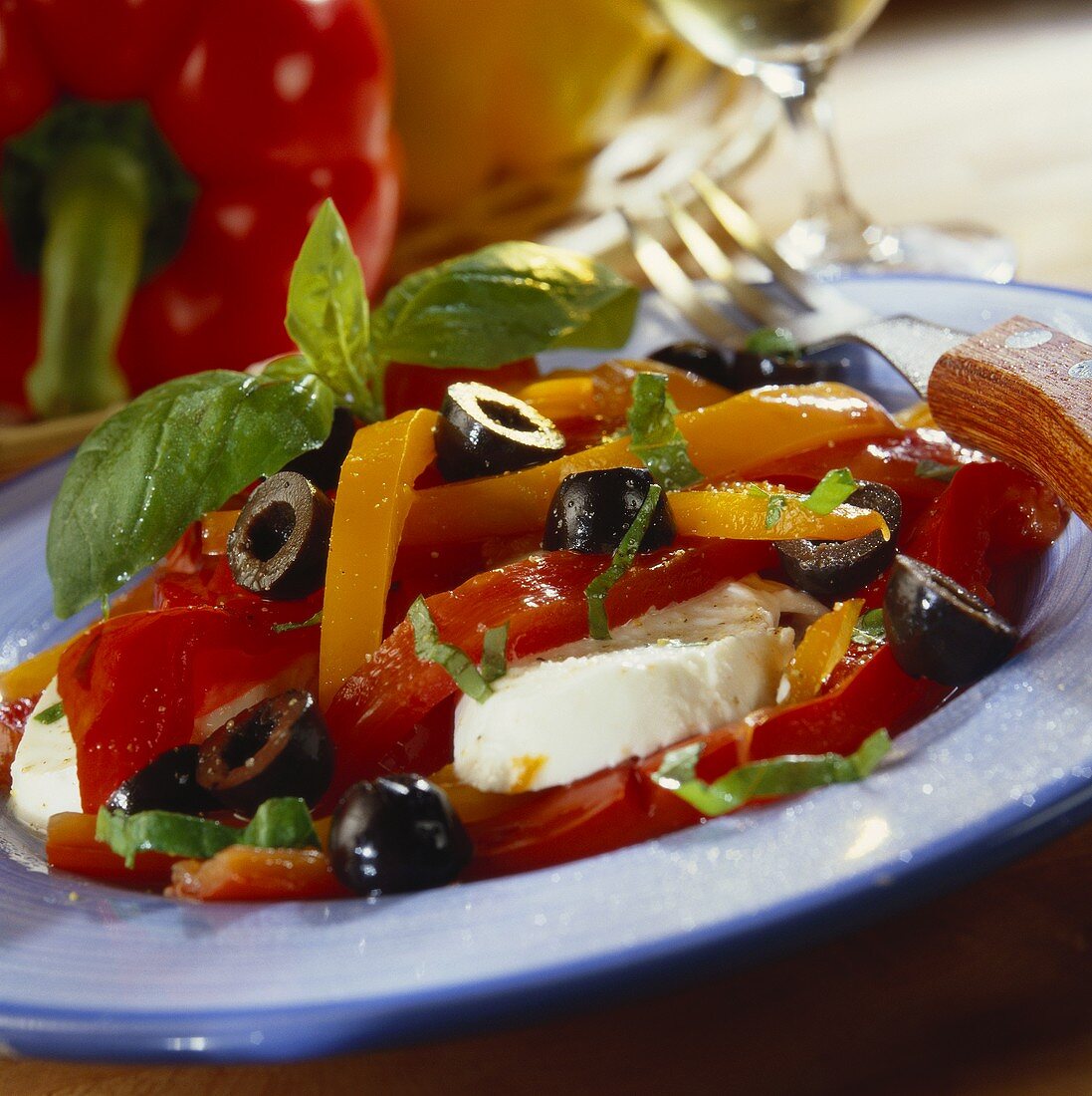 Pepper salad with olives and mozzarella