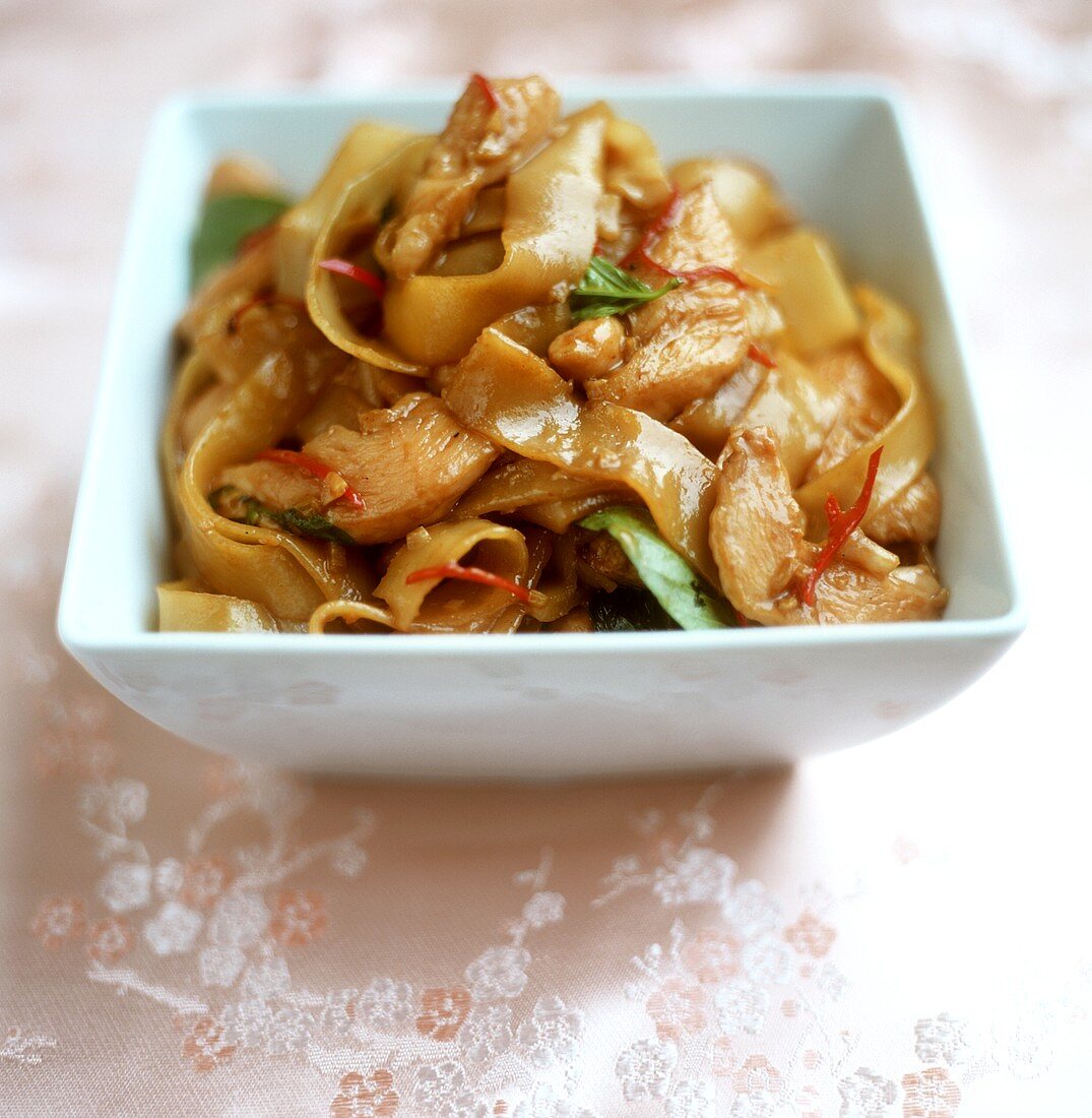 Sweet and sour pork on rice noodles