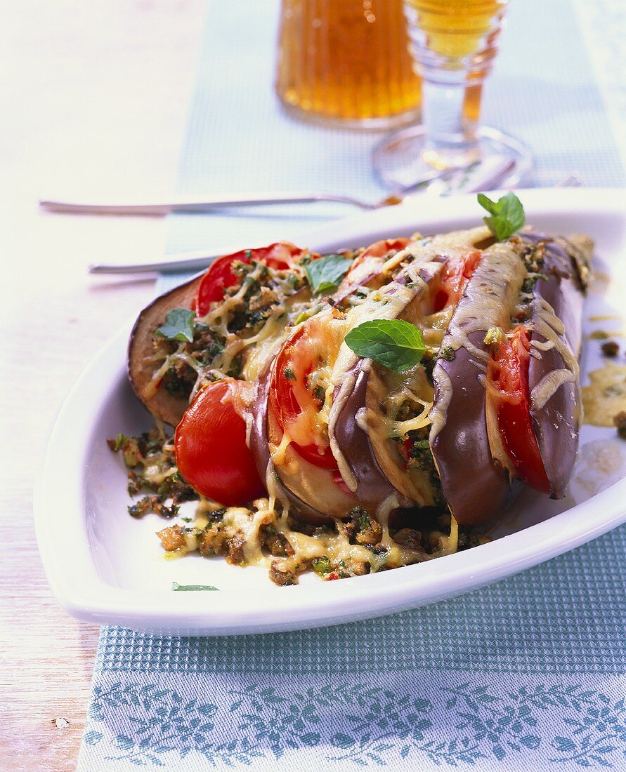 Aubergines stuffed with tomatoes, mushrooms and cheese 