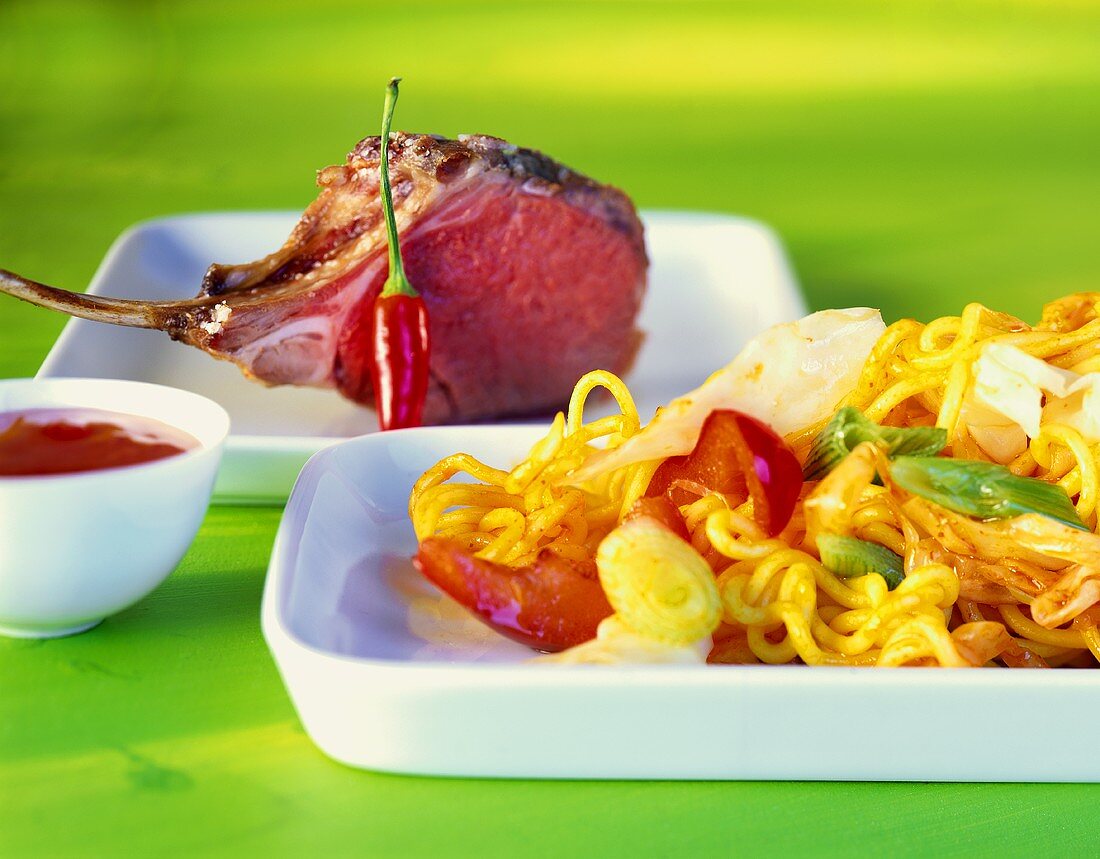 Lamb cutlets with egg noodles and white cabbage
