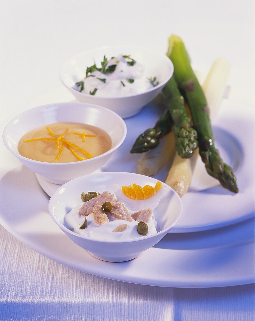 Cooked asparagus with three sauces