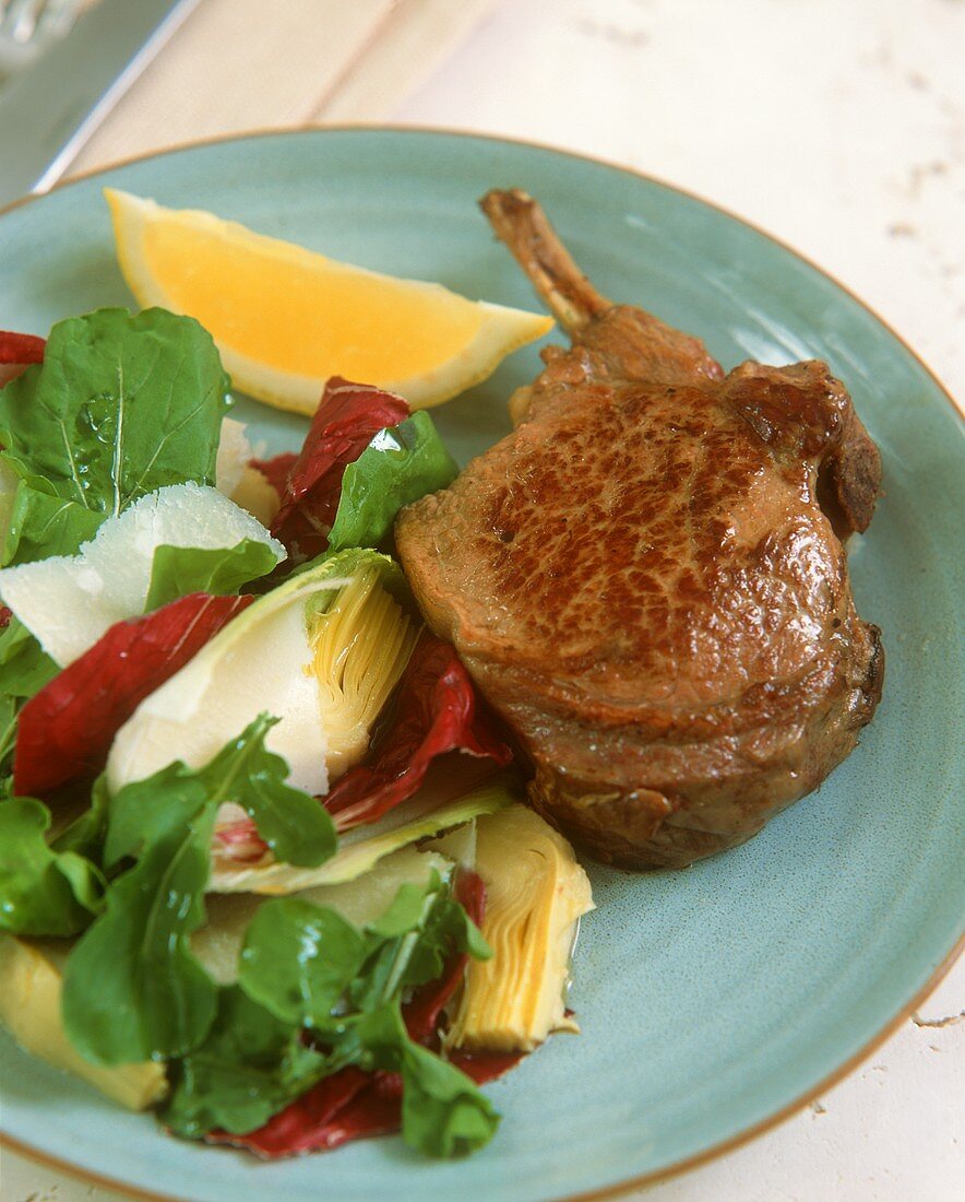 Lamb cutlet with artichoke salad