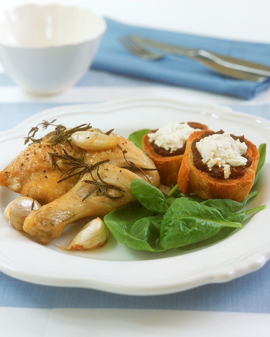 Chicken leg with herbs and garlic; crostini
