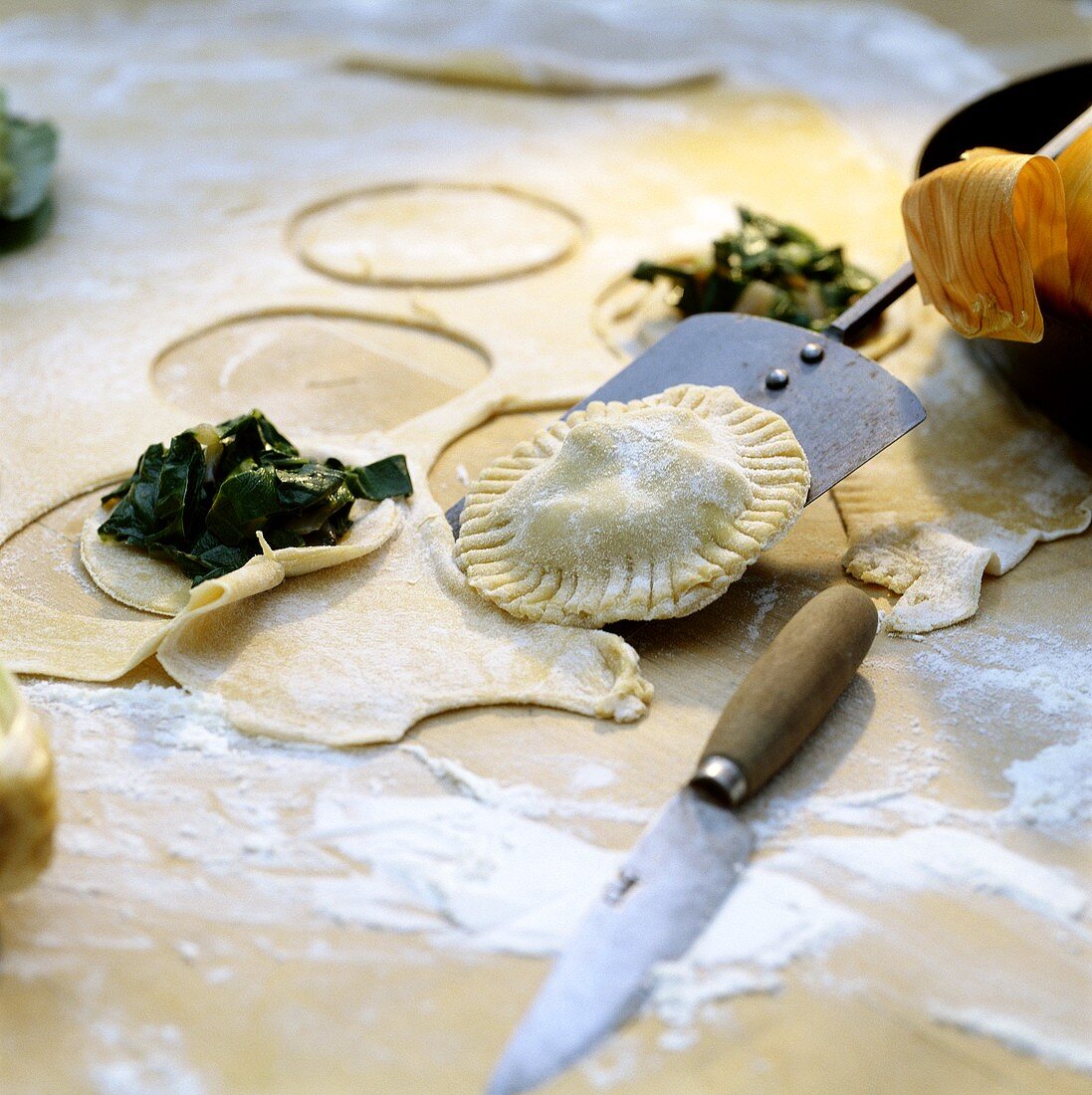 Making spinach pasties