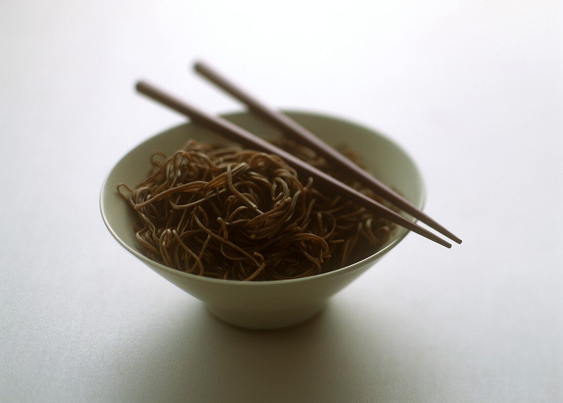 Asian noodles in bowl with chopsticks