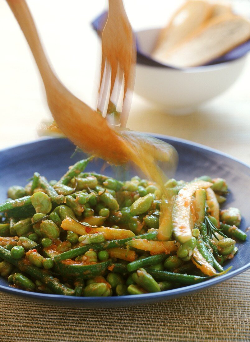 Beans, peas and courgettes with walnut sauce