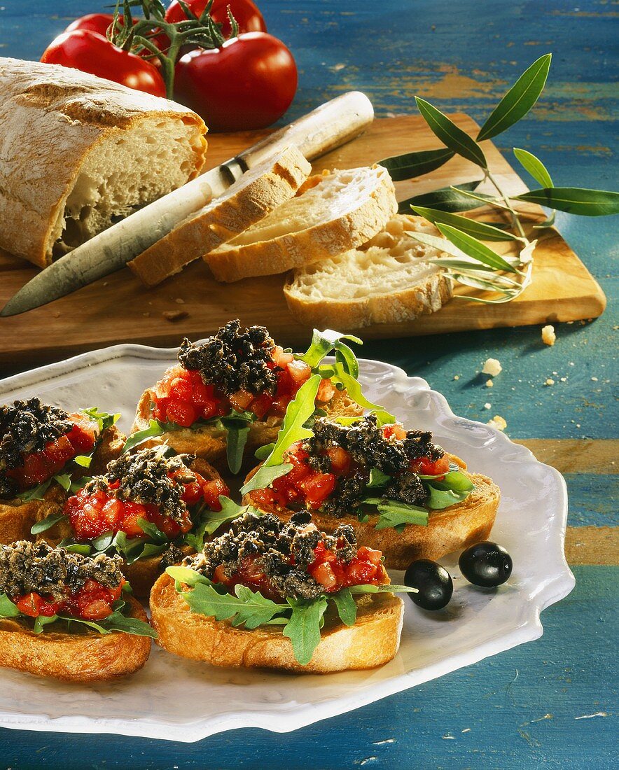 Crostini with tomatoes and olive paste