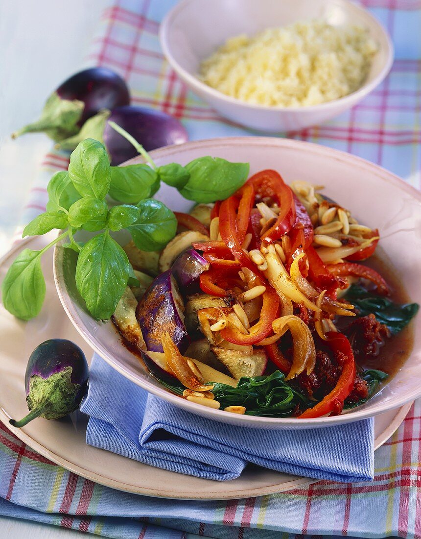 Aubergines with peppers and mushrooms, cooked in wok