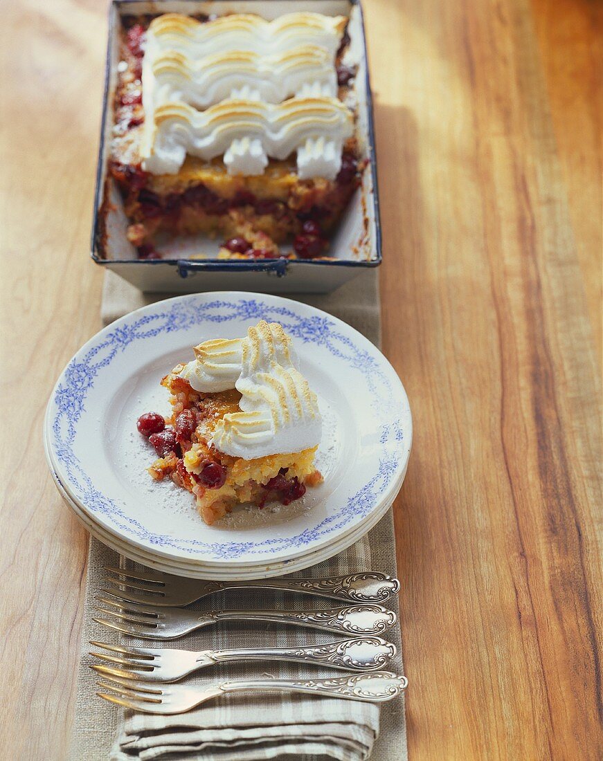Baked rice pudding with morello cherries and meringue topping