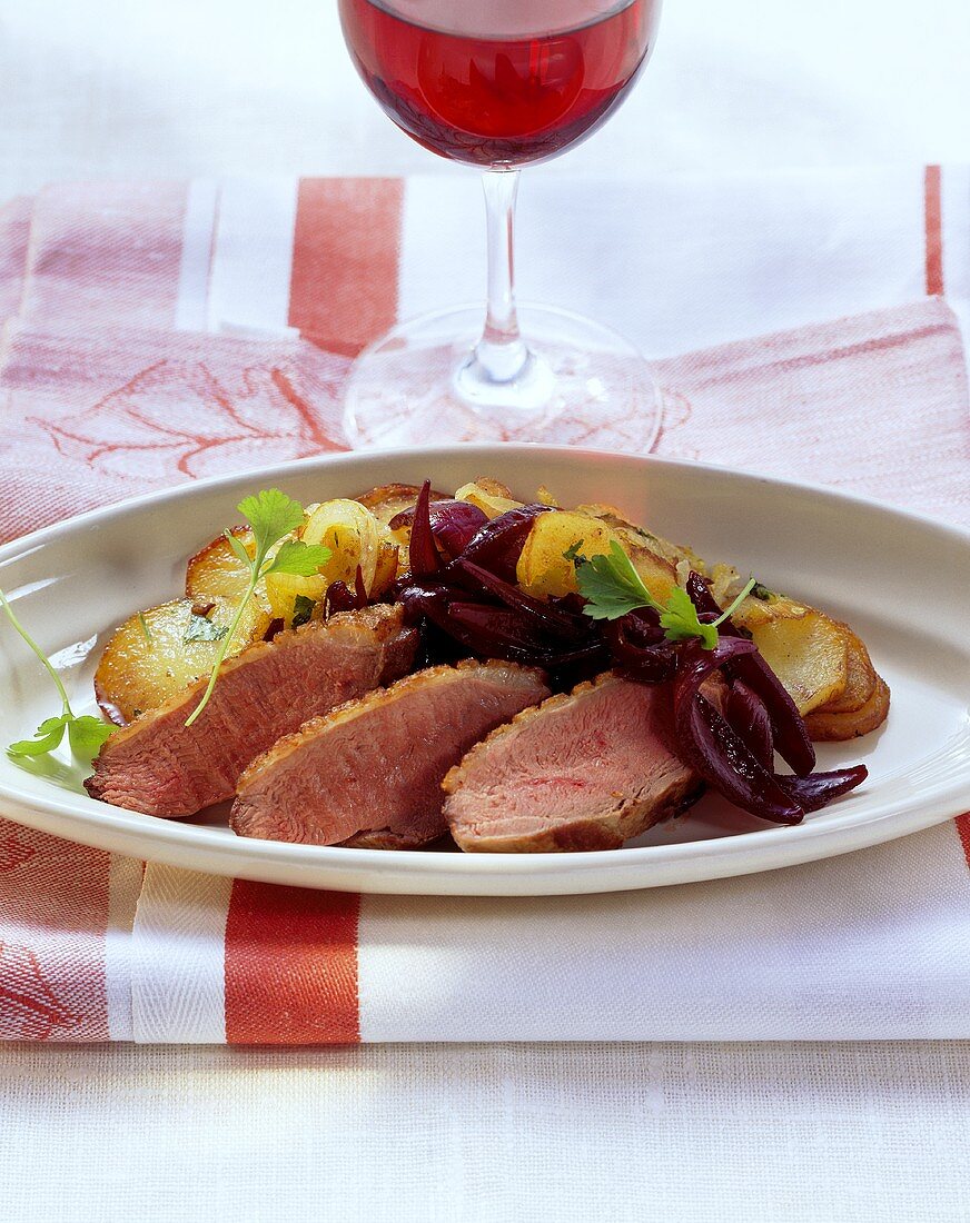 Duck breast with onion confit and fried potatoes