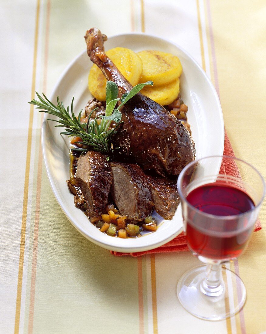 Goose braised in red wine with polenta slices