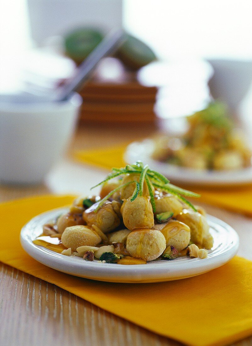Struffoli (Fried pastry balls with honey sauce & nuts, Italy)