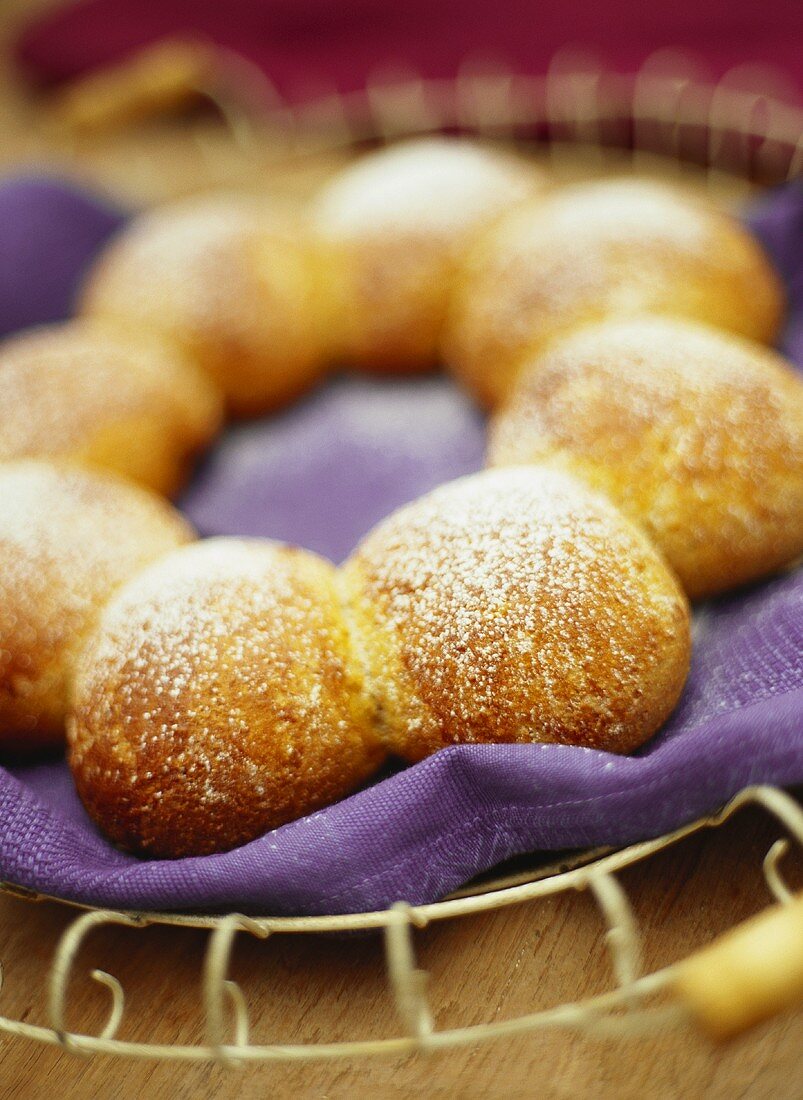 Sweet bread roll ring with icing sugar
