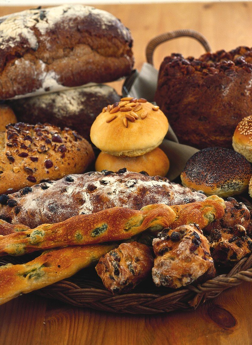 Assorted bread and rolls, some with fruit