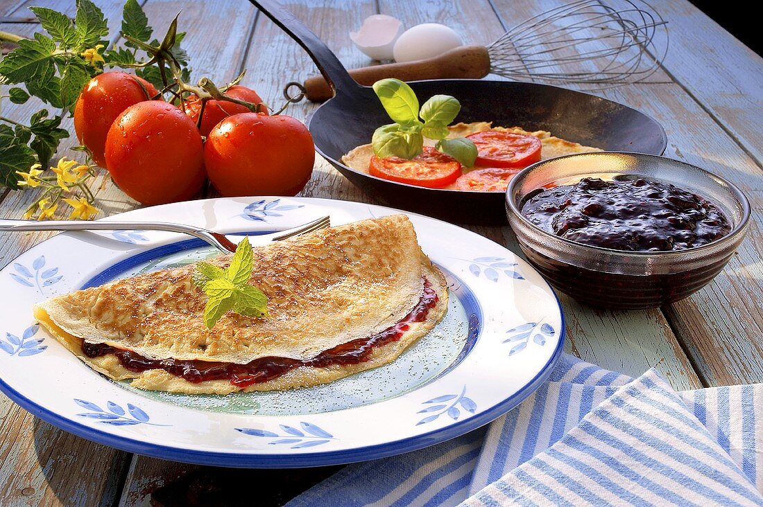Crepe with blackberry jelly and with tomato and basil