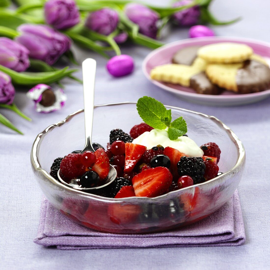 Berry salad with cream and mint