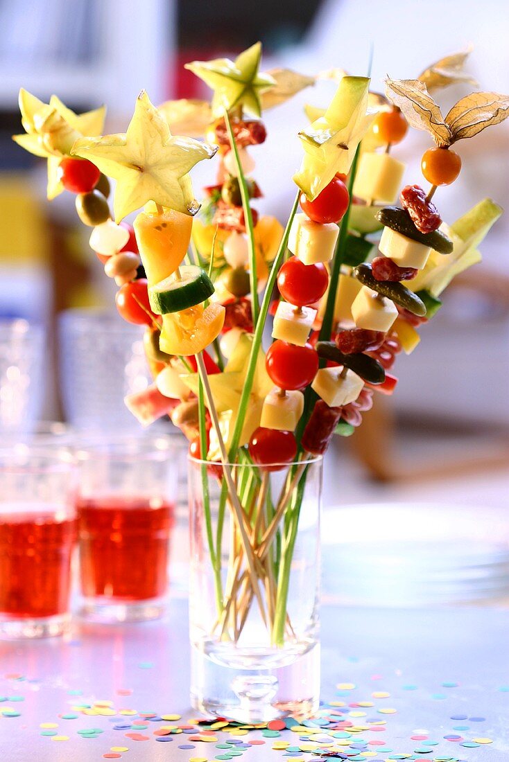 Colourful kebabs with vegetables, cheese and fruit