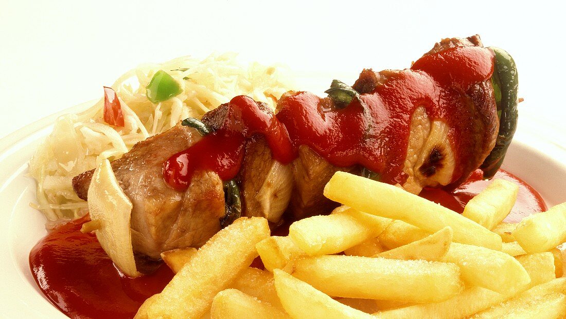 Meat kebab with ketchup and chips