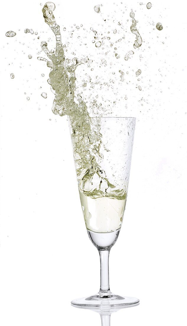 Prosecco splashing out of glass