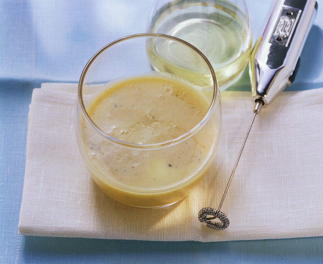 Vinaigrette in glass; mini-whisk