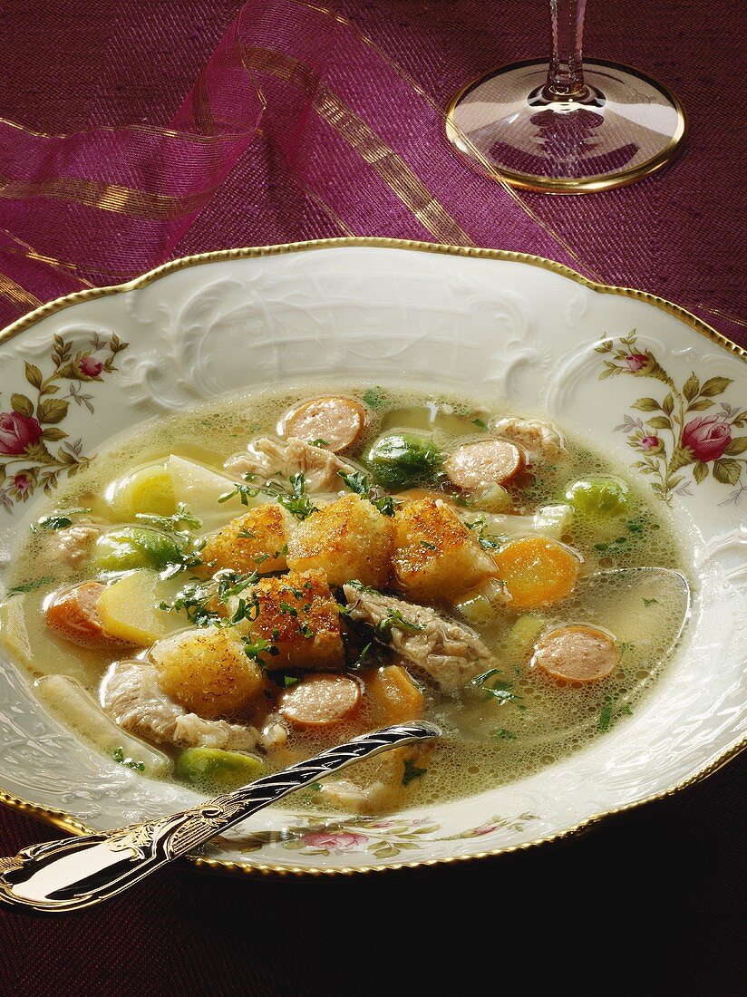 'Schnippel' soup with meat and croutons