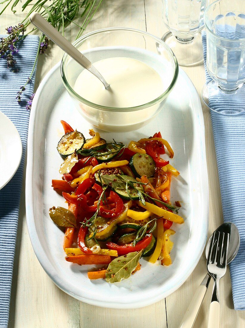 Roasted vegetables with herbs and yoghurt sauce