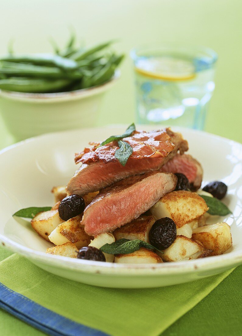 Lamb with sage, olives and roast potatoes