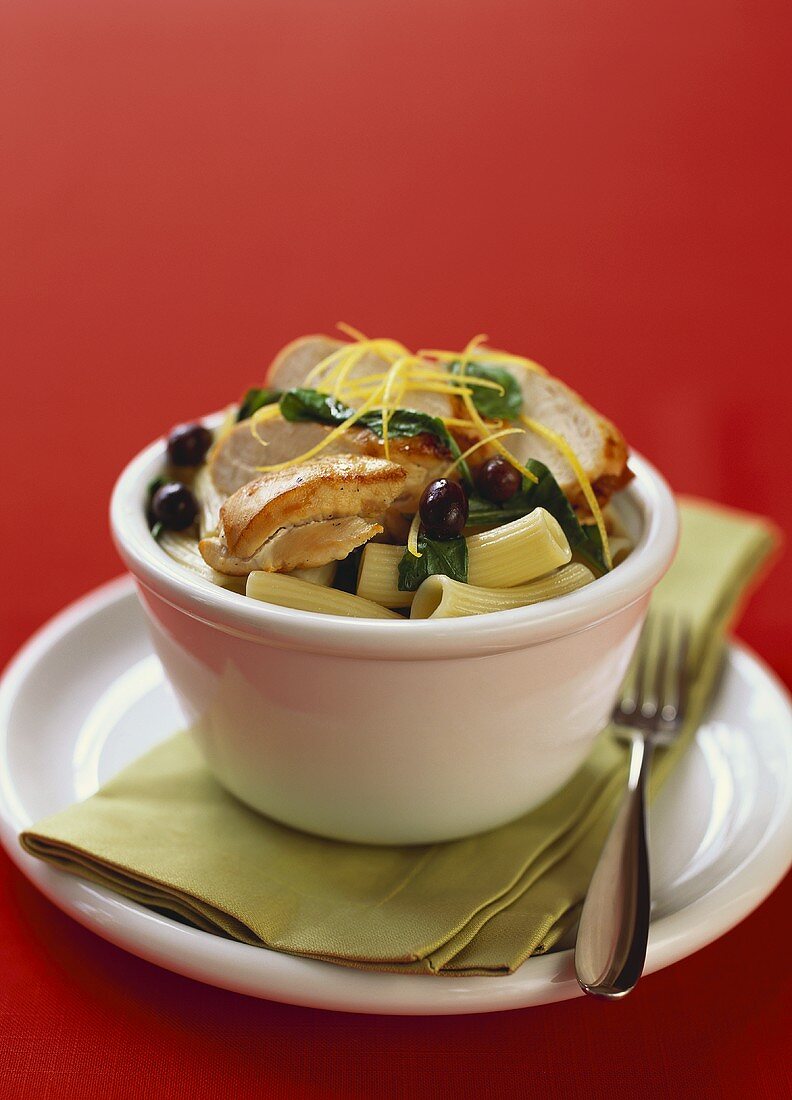 Pasta with chicken, rocket, olives and lemon zest