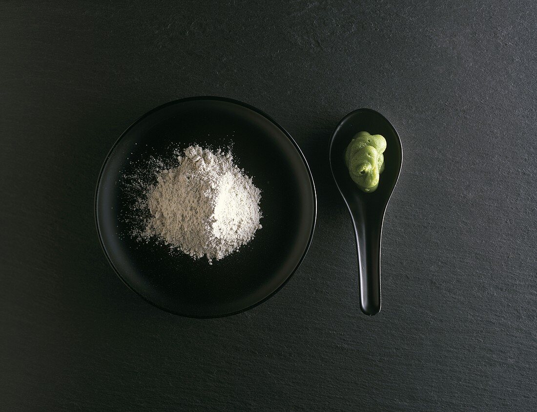 Wasabi powder in small bowl; wasabi paste on spoon