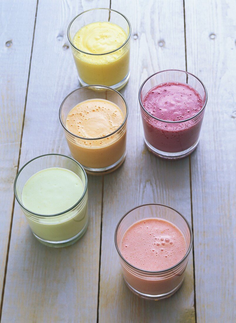 Various yoghurt drinks with fruit and avocado