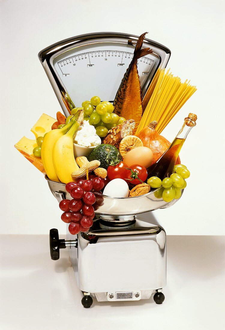 High-calorie foods on scales