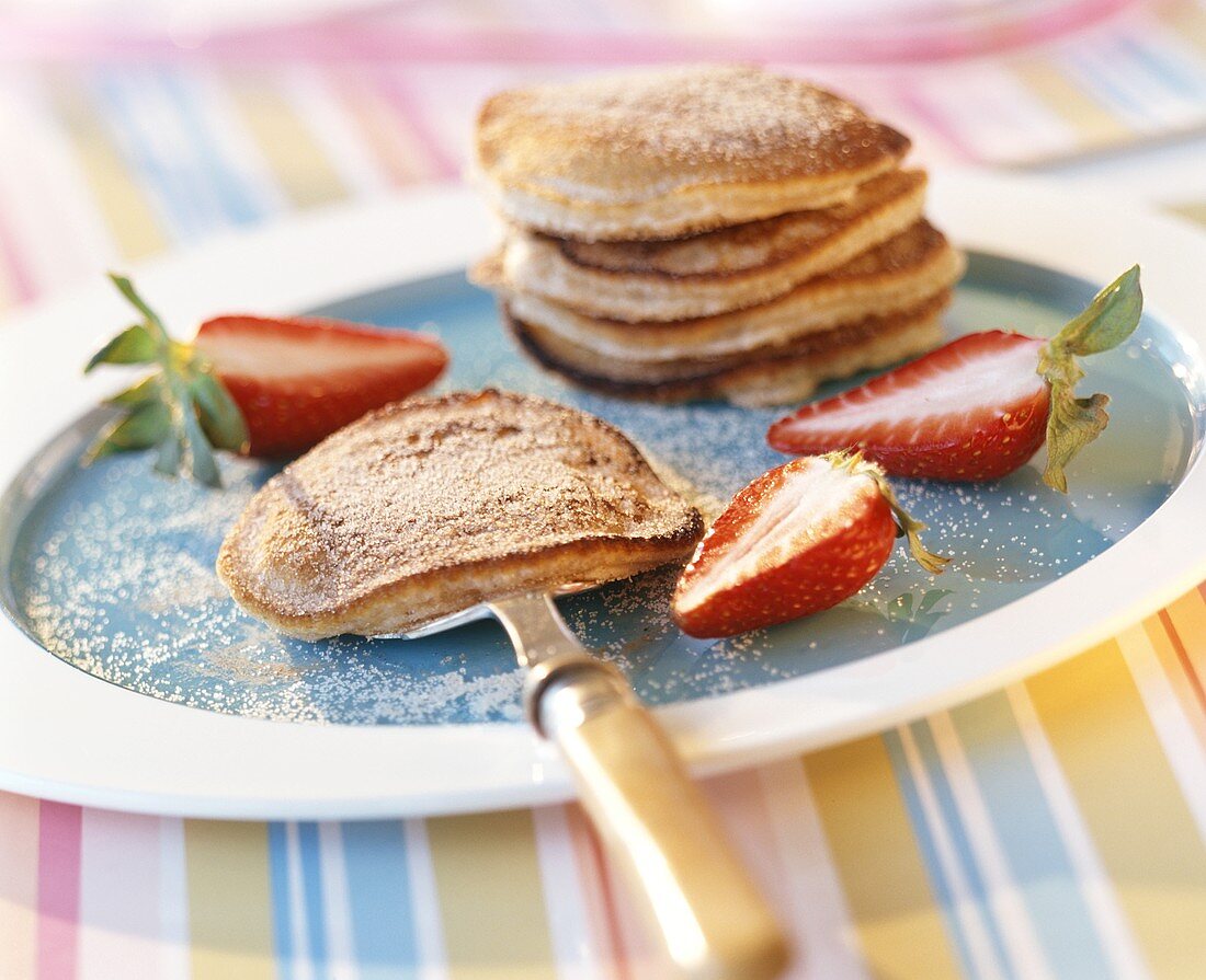 Pancakes with cinnamon sugar and fresh strawberries