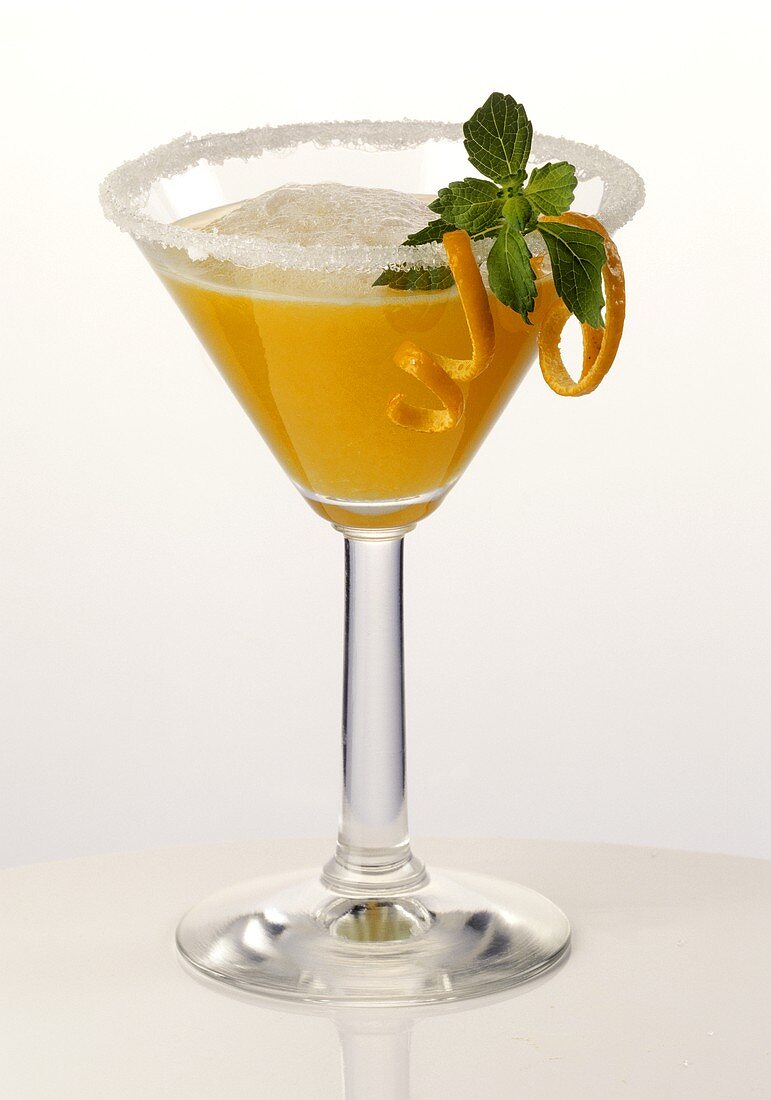 A glass of orange margarita