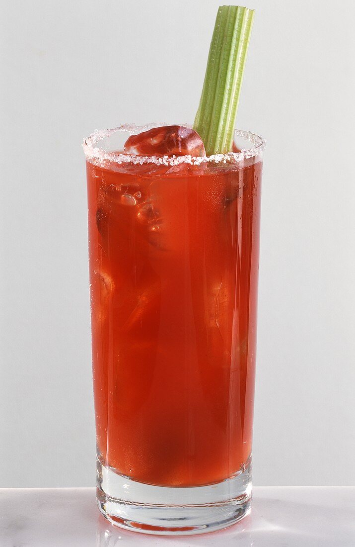 Bloody Mary in long drink glass, garnished with stick of celery