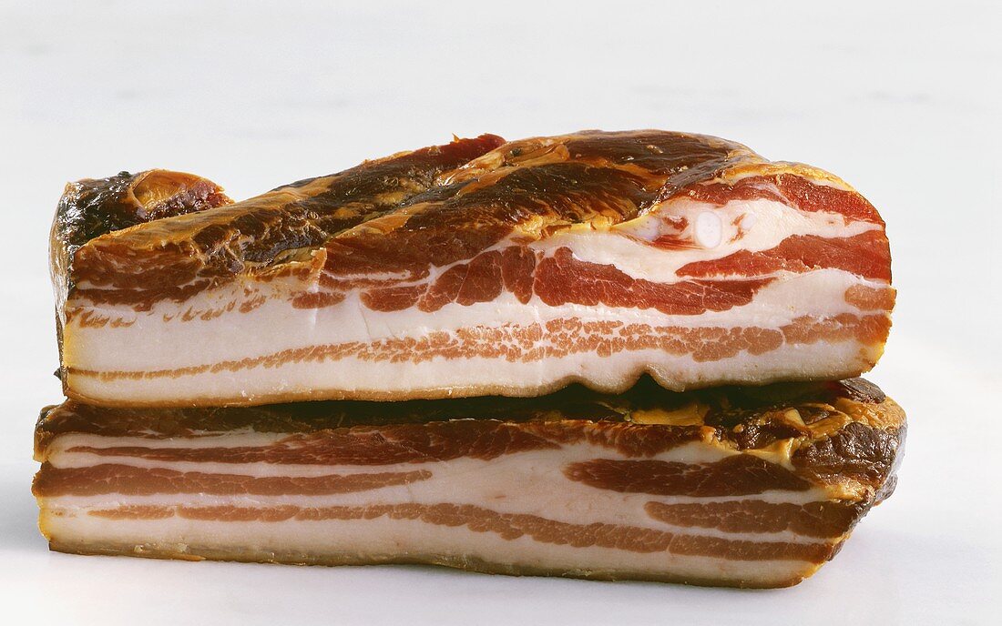 Two pieces of smoked streaky bacon