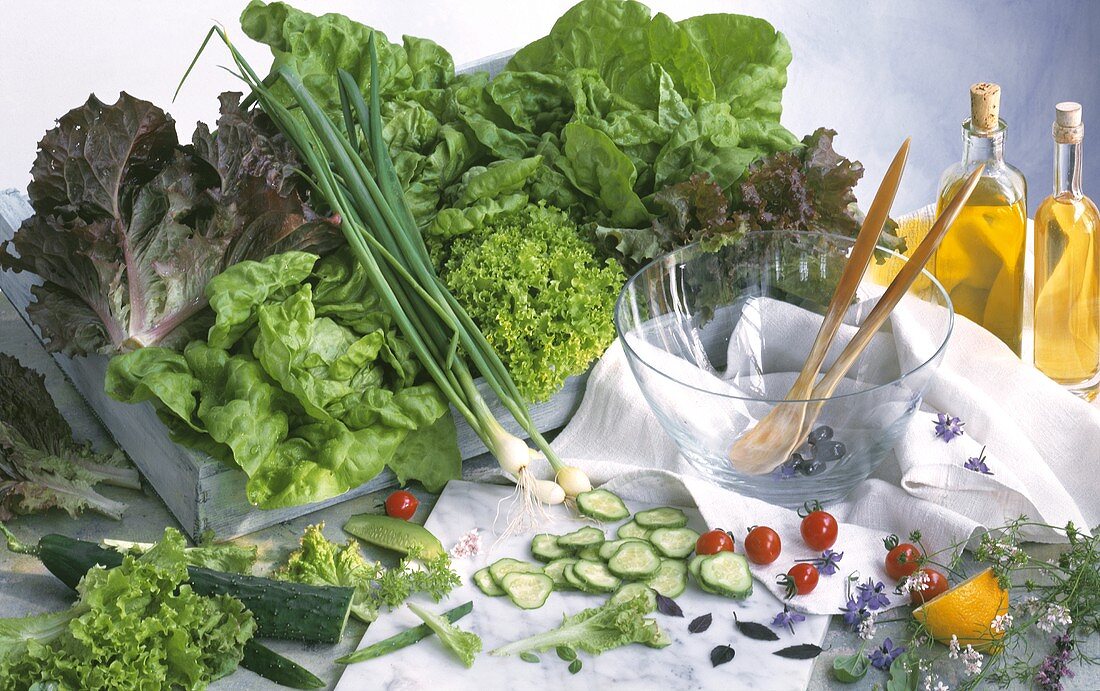 Wooden box with various salad leaves, salad ingredients