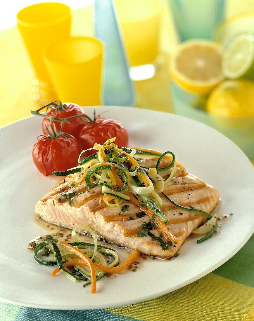 Grilled salmon trout with grilled tomatoes on a plate