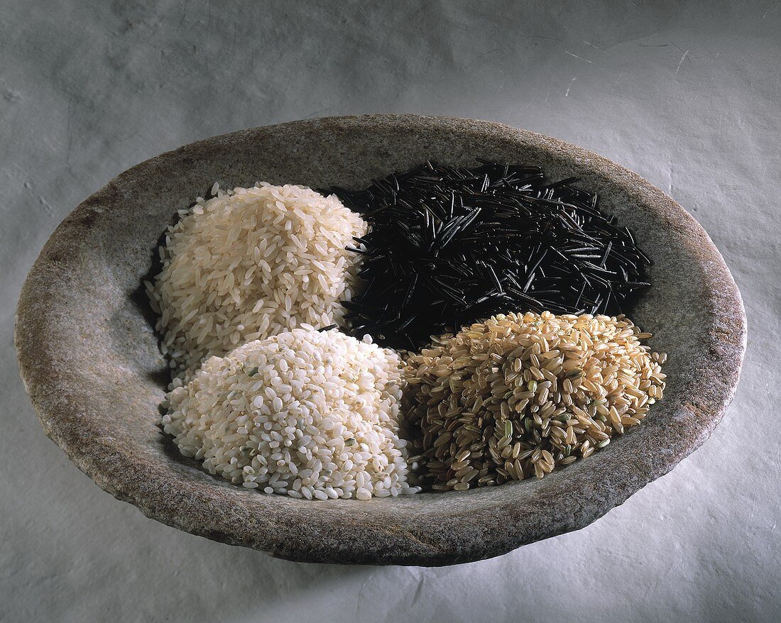 Four different types of rice in a bowl