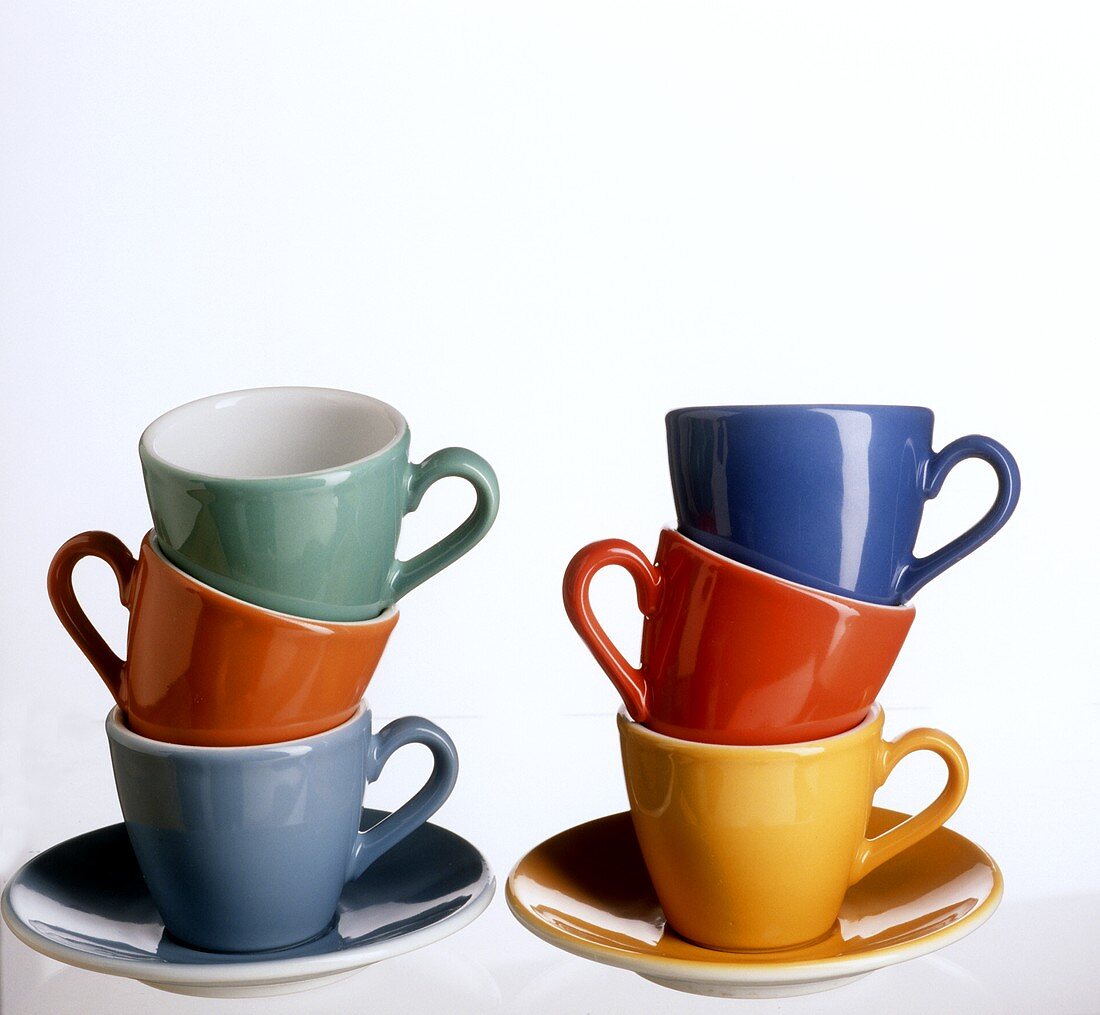 Coloured coffee cups, in a pile
