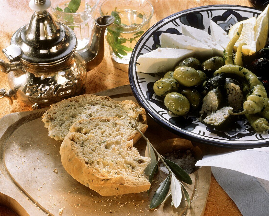 Plate of mixed appetisers, olive bread and tea