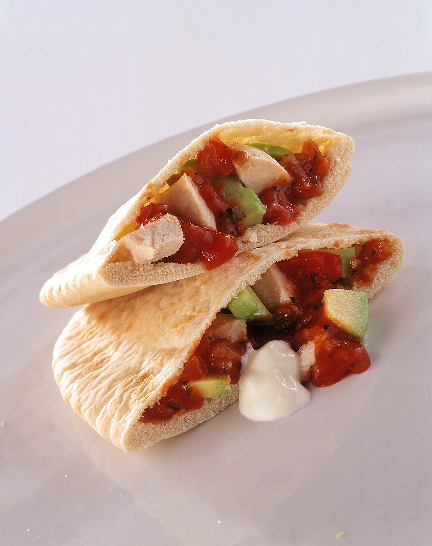 Two Pitas Filled with Chicken, Vegetables, Salsa and Sour Cream