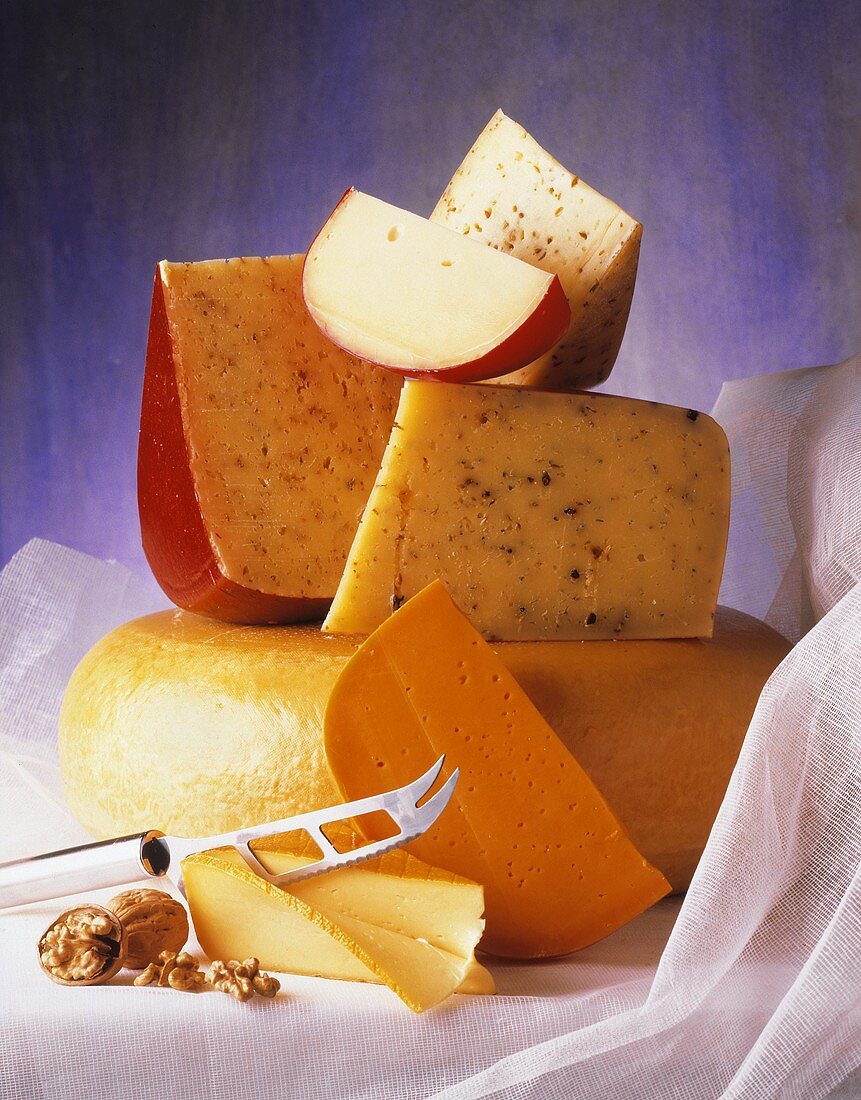 Assorted Cheeses with Cheese Knife and a Walnut